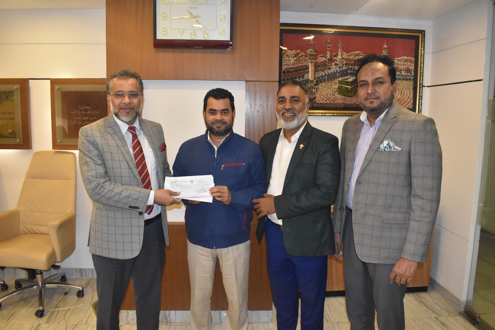 Marine Cargo Insurance claim cheque being handed over to the Banani Branch Manager of M/s. Norp Knit Industries Ltd